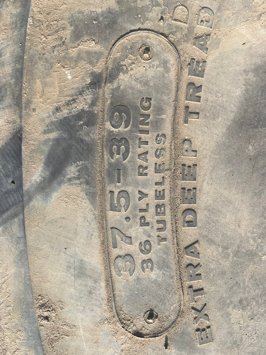 Bridgestone 37.5-39 scraper tire used.